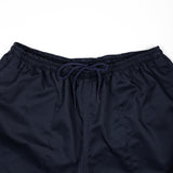 Navy blue shorts with drawstring on a white background