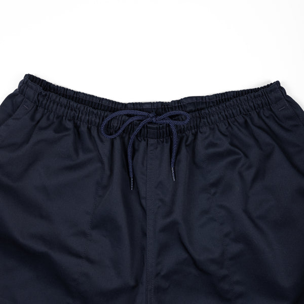 Navy blue shorts with drawstring on a white background